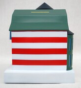 貯金箱側面。神様よりも楳図さま？ 紅白ボーダーは幸運の色。