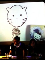 八巻氏が「最長不倒距離」と評した福本画「キティちゃん」。横に示された本物を見て福本はひと言「おお、似てるじゃんか」。会場は感動の涙に包まれた。