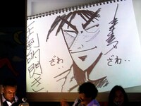 カイジの右頬に独特のシャドウが入れられ完成が近づくと、背景に「ざわ……」の文字が書き込まれ、会場はやんやの拍手。「天上人」はどんなお題を描かせるより、自ら生み出したキャラクター執筆の手法が凄かった。