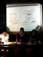 福本画「犬と猫」。「スゴイっす。福本さんスゴイっす」と八巻氏が褒め称えれば、「この猫……前足……」とサイバラは絶句。