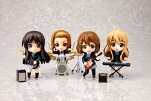 これまで発売された「けいおん！」ねんどろいど。左から秋山澪、田井中律、平沢唯、琴吹紬。(c)かきふらい・芳文社／桜高軽音部