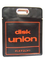 「ディスクユニオン」のロゴ面。(c)かきふらい・芳文社/桜高軽音部 / (c)ディスクユニオン