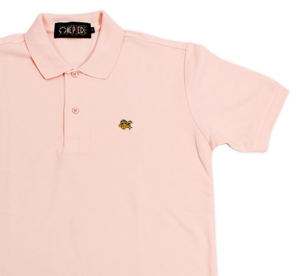 ナミをイメージした「ONE PIECE FOOTBALL LINEポロシャツ」のピンク。(C)尾田栄一郎／集英社・フジテレビ・東映アニメーション