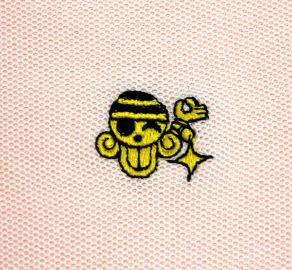 ナミをイメージした「ONE PIECE FOOTBALL LINEポロシャツ」のピンク。(C)尾田栄一郎／集英社・フジテレビ・東映アニメーション