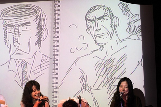 スクリーン左がコンドウ、右がヤマザキの描いた「ゴルゴ13」。肌の露出もだが、髪の量もぜんぜん違う。