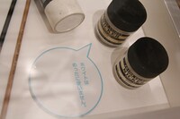 マンガを描くときに使用する画材の展示。写真はホワイト。フキダシに注目。(c)Fujiko-Pro