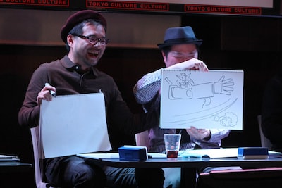 ガンダムのイラストを交え回答する太田垣康男（右）。
