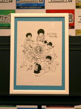 吉田秋生の直筆イラストは、額に入れられて壇上に飾られていた。