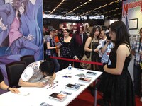 池野雅博がサイン会を行う様子。