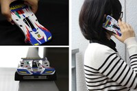 「ミニ四駆スマートフォンカバー マグナムセイバー（iPhone5専用）」を使っているところ。事前のブレークインも不要だ。 (c)こしたてつひろ／小学館・ShoPro