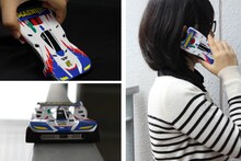 「ミニ四駆スマートフォンカバー マグナムセイバー（iPhone5専用）」を使っているところ。事前のブレークインも不要だ。 (c)こしたてつひろ／小学館・ShoPro