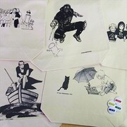 IKKIとヴィレッジヴァンガードのコラボトートバッグと缶バッジ。