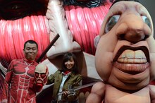 （左から）千原せいじ、吉木りさ、3m級巨人。後ろには1/1スケールの超大型巨人が。