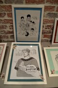 マンガ大賞2015授賞式会場に展示された、過去の受賞作のイラスト。