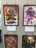 「第四回 武者絵展」の展示の様子。左上が吉崎観音「宇宙天魔王、降臨！」。
