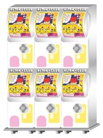 「独身OLのすべて メタルチャーム」のカプセル自販機イメージ。