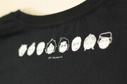 「くいもの処 明楽」のTシャツ。