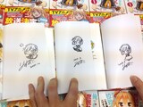 りすまいが1冊1冊すべてにサインとイラストを描き下ろした。