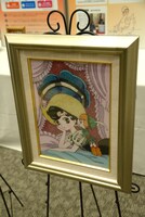 会場に展示された手塚治虫作品の「ジュエリー絵画」。