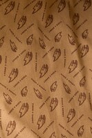 タイガーマークとタイトルロゴがあしらわれた裏地。