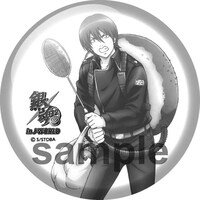 「あんぱんガラポン」でもらえる白い缶バッジ。