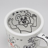 プレゼントキャンペーンで当たる、直筆イラスト入り「まん○画太郎×TENGA ドクミ マグカップ」。