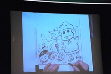 しりあがり寿と西原理恵子によるイラストが描かれた色紙。5日後に誕生日を迎えるという会場の男性にプレゼントされた。