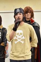 魔地機関長役とアクションコーディネーターを兼任する岩尾隆明。