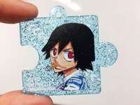 商品を5000円購入するごとにランダムでプレゼントされる「継承アクリルキーホルダー」のラメ入りバージョンの1種。