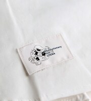 「薔薇の紋章シャツ」のタグ。