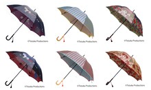 「日本名作倶楽部 手塚治虫生誕90周年記念 郡内織 晴雨兼用長傘」。左から「鉄腕アトム」柄、「ユニコ」柄、「リボンの騎士」柄。