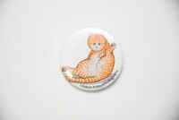 「マイケル 七分袖ラグランTシャツ」に付属する缶バッジ。