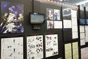 MAPPAのコーナーより、「かつて神だった獣たちへ」の展示。(c)めいびい・講談社／かつ神製作委員会