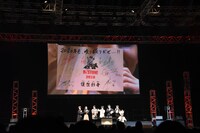 「Dr.STONE」ステージイベントより。プリントゴッコで作られた年賀状がスクリーンに映されている。