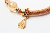 「『デジモンアドベンチャー』ワインドコードブレスレット」のチャーム。