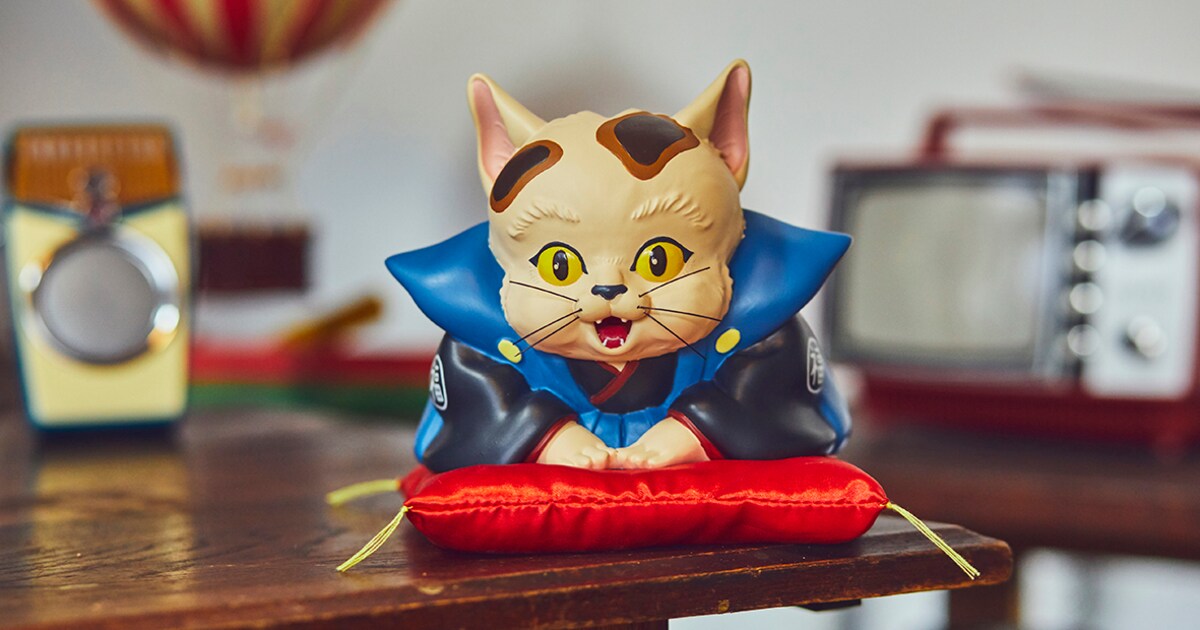 平成狸合戦ぽんぽこ」“猫福助”の貯金箱や手ぬぐい、Tシャツ発売 