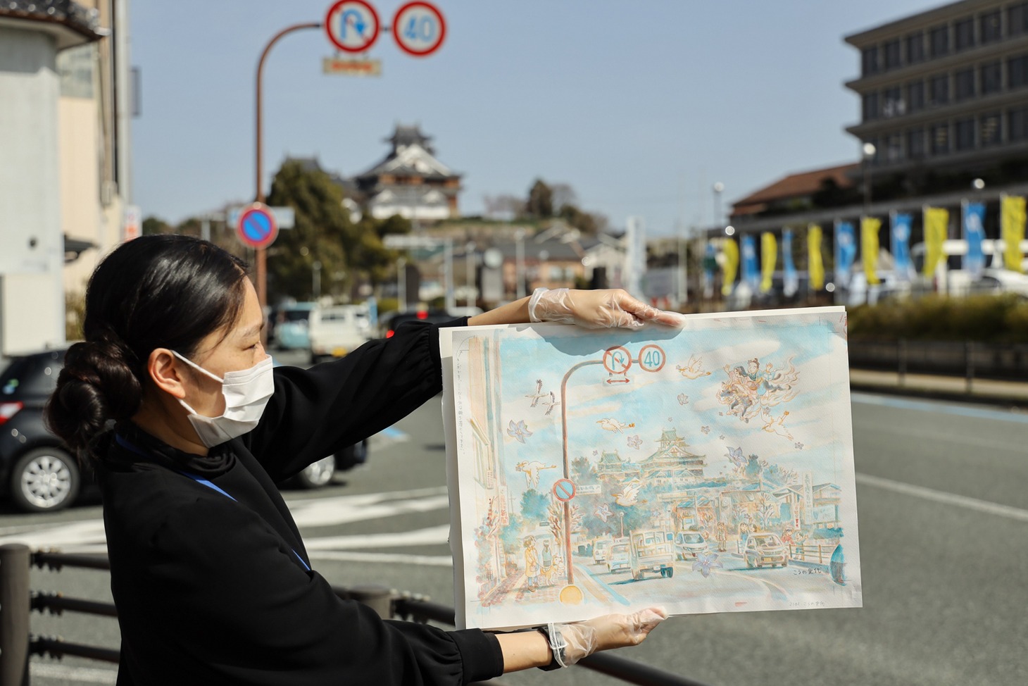 「麒麟のいる街」のイラストと福知山の街並み。（提供：京都府福知山市）