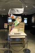 アニメ制作会社の仕事場をイメージした展示物。
