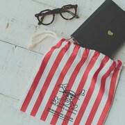 「Going Merry LOGBOOK」とメリー号の帆を
イメージして作ったコットンの巾着。