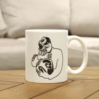 スカート「222だから実家の猫が嫌そうな顔してる写真置いときますね」マグカップ