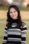 三浦理奈扮する田島あいこ。 (c)「シガテラ」製作委員会