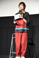 ザフトっぽい色の衣装を着て登壇した吉田尚記。「機動戦士ガンダムSEED　DESTINY」に声優として出演した過去を持つ。