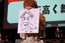 橘龍丸による「天高く舞う泣いた小西克幸」。