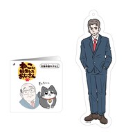 飼い主が描かれた「ねこに転生したおじさん プンちゃん 等身大ぬいぐるみ」の紙タグ。