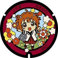 赤座あかりのマンホール蓋。富岩運河環水公園内に設置。