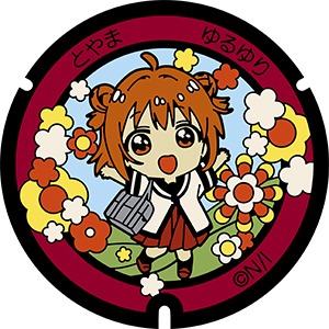 赤座あかりのマンホール蓋。富岩運河環水公園内に設置。