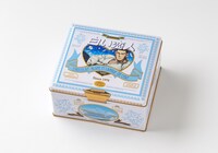 「白い恋人」谷垣源次郎デザインのコラボ缶。