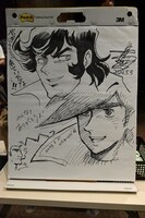 会場に飾られた島本和彦と野口征恒のイラスト。