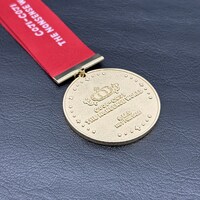 特典付き入場チケットの購入でもらえるオリジナルメダル。 ※デザイン・仕様等は変更になる可能性あり。