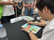 木下麦監督のサイン会の様子